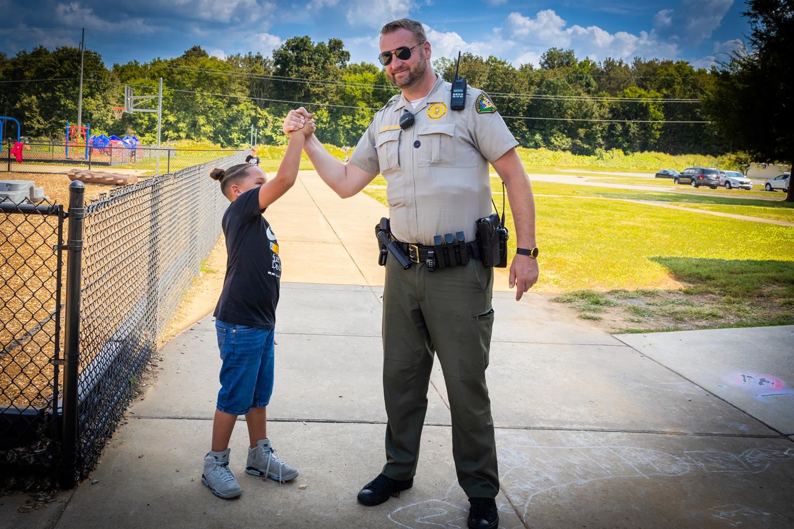 sro and student high fiving